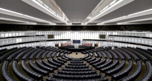 Empty European parliamentary chamber with semicircular rows of seats
