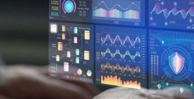Person viewing colorful data dashboards with charts and analytics graphics